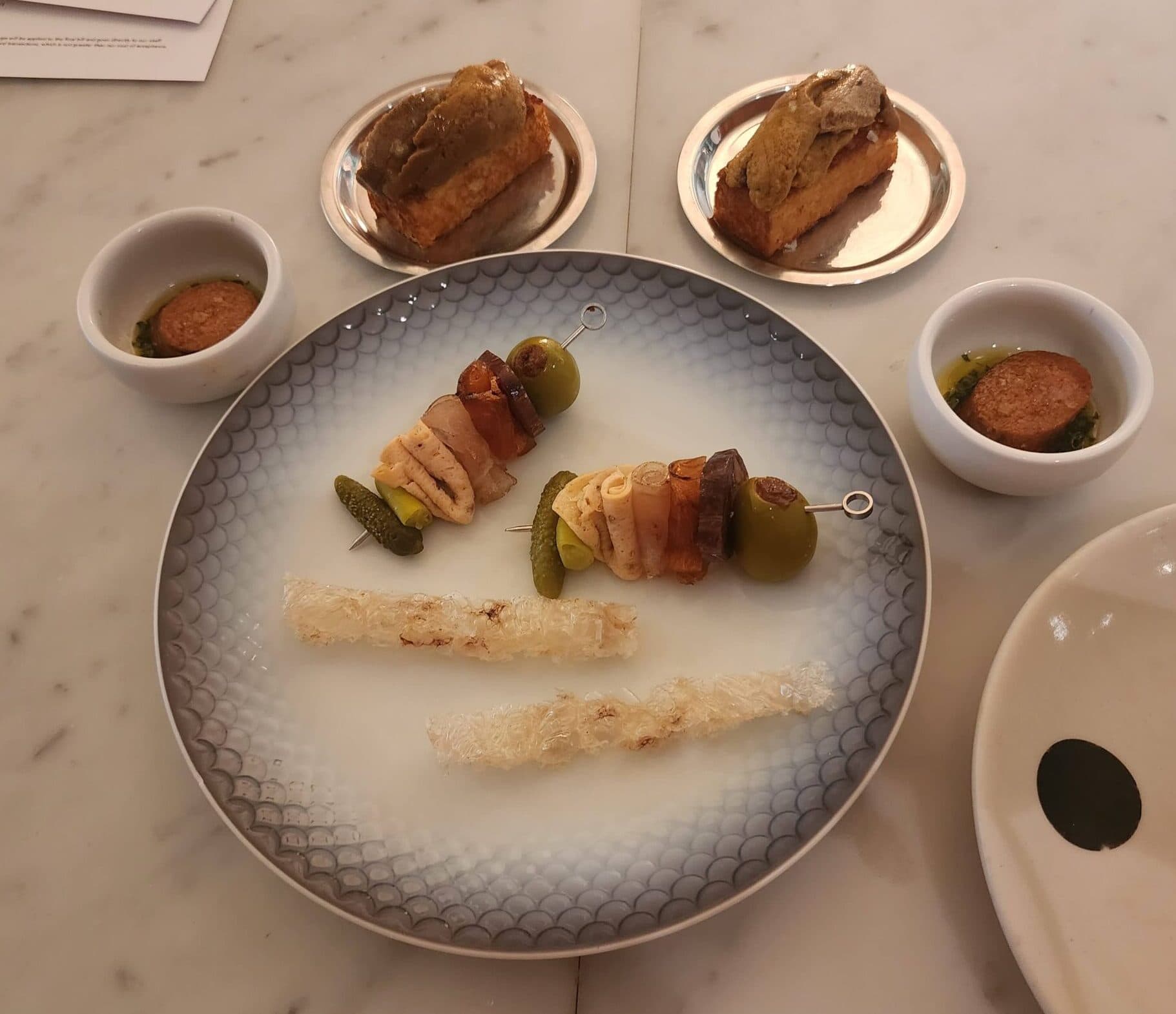 The Fish Butchery Charcuterie at Saint Peter, a plate of small cured and smoked fish preparations