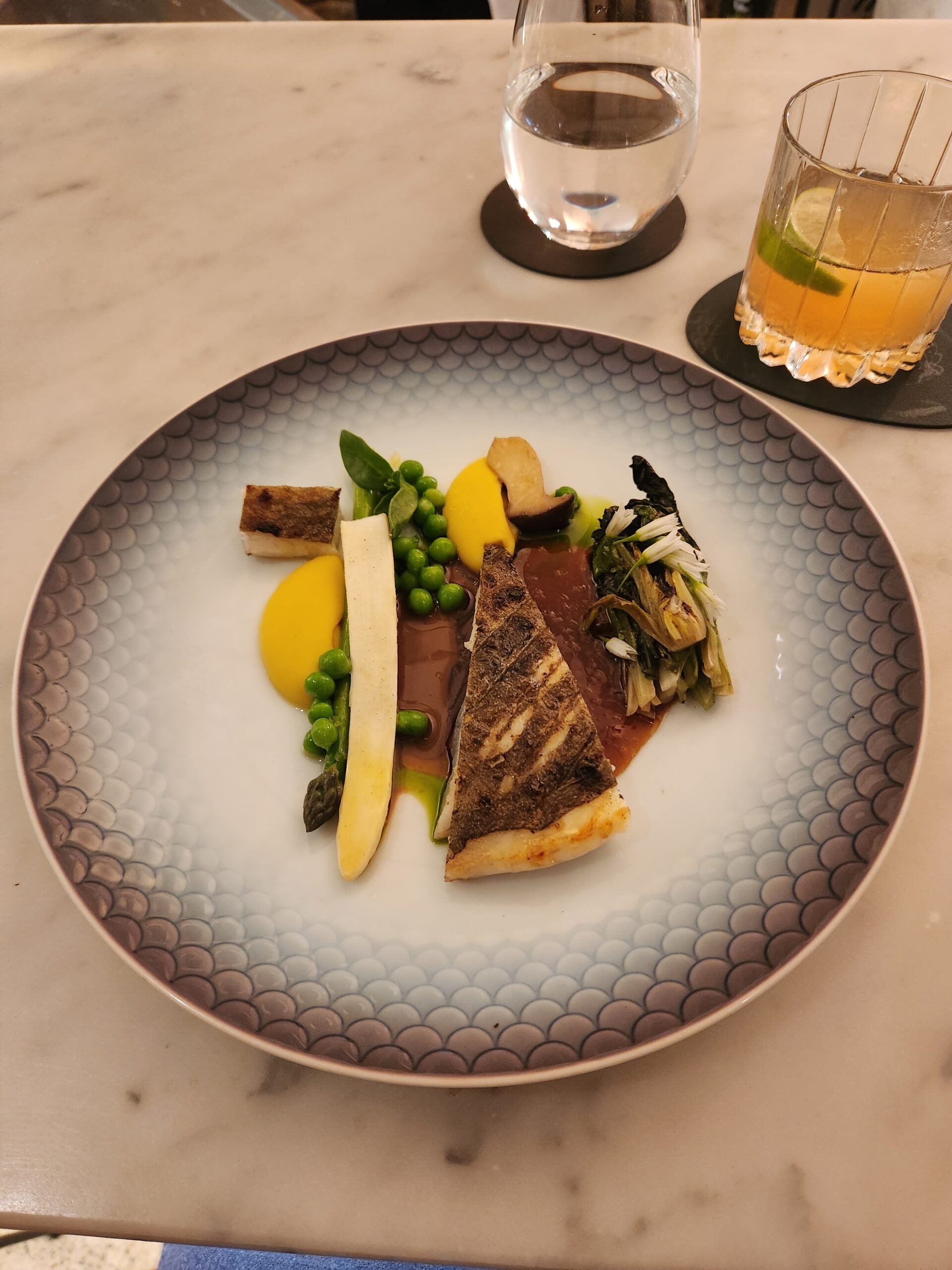 Line Caught John Dory with spring vegetables, BBQ lettuce, macadamia and fig leaf at Saint Peter
